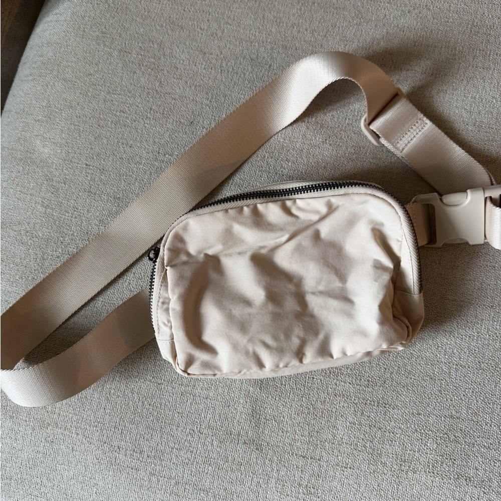 Lightly used cream belt bag